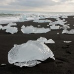 Icebergs-from-the-Jkulsrln-glacier-lagoon-wash-ashore-black-sand-beach-in-Iceland-8×6.jpg